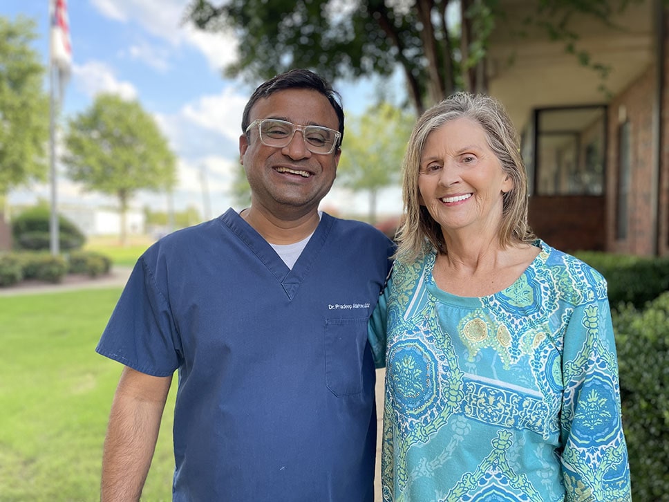 Dr Adatrow with happy patient 