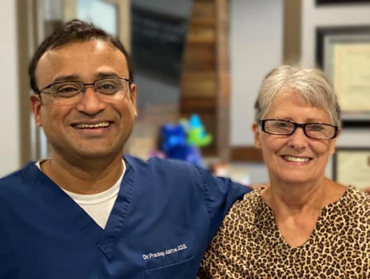 Dr. Adatrow with his patient who got all on x dental implants at Advanced Dental Implant and TMJ Center, Cordova TN